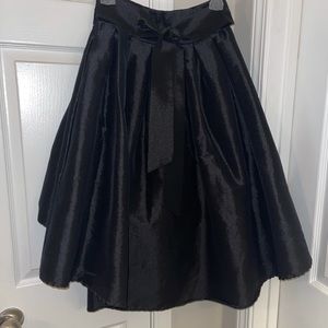 Classic asymmetric black a-line skirt